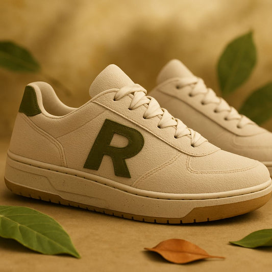 Eco-friendly sneakers made from recycled materials on a green background with leaves