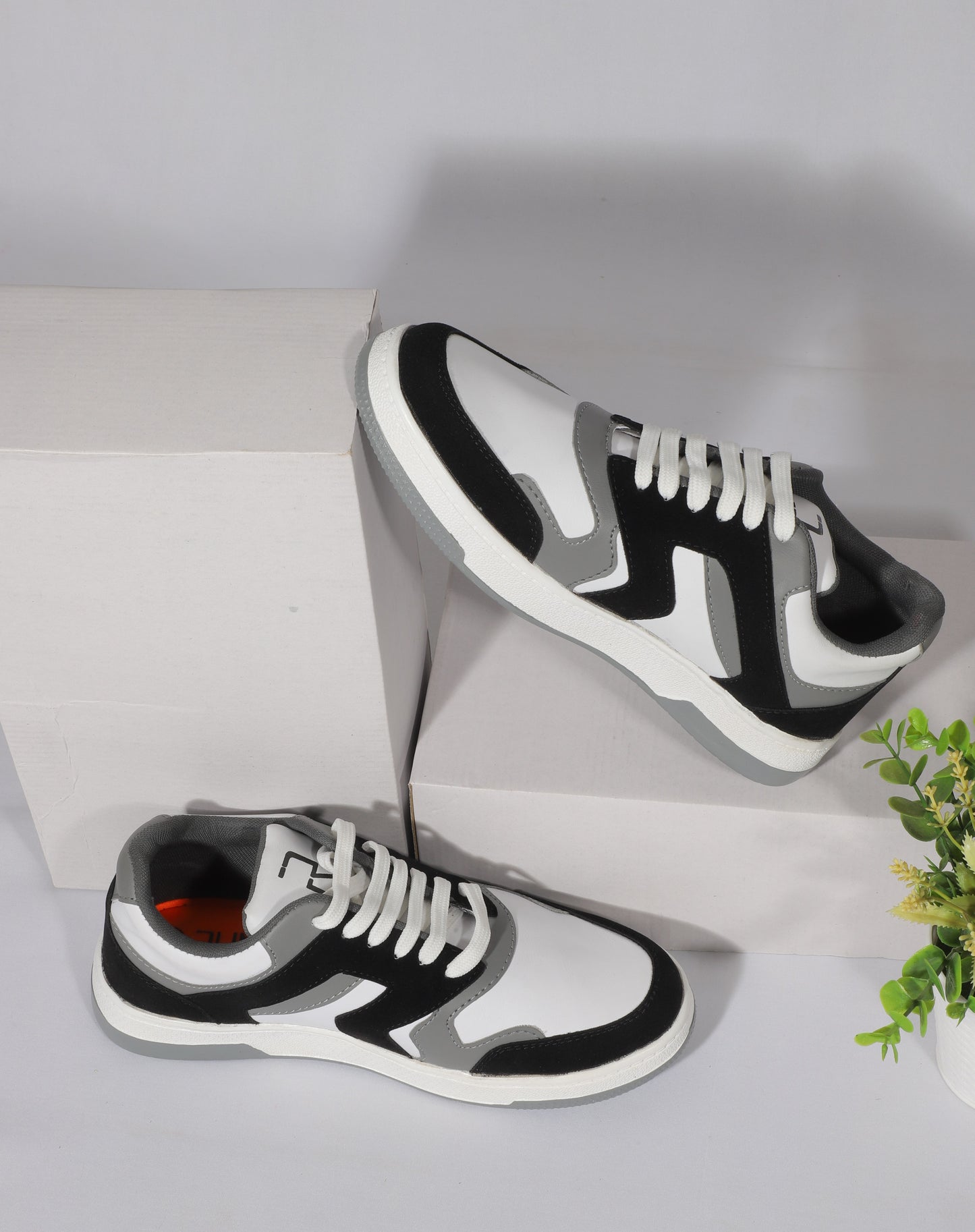 Rumani’s Flexfit Black & White Luxe Sneakers for Men