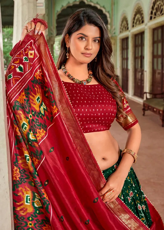 Green Tussar Silk Fabulously Patola Printed Stitched Lehenga & Blouse With Dupatta